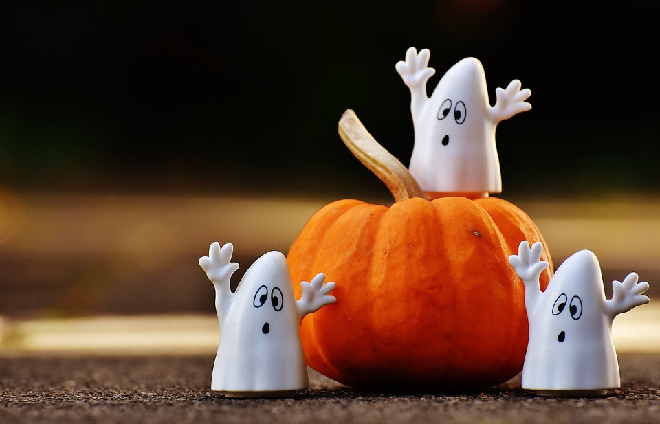 Three Ghost figurine and a pumpkin